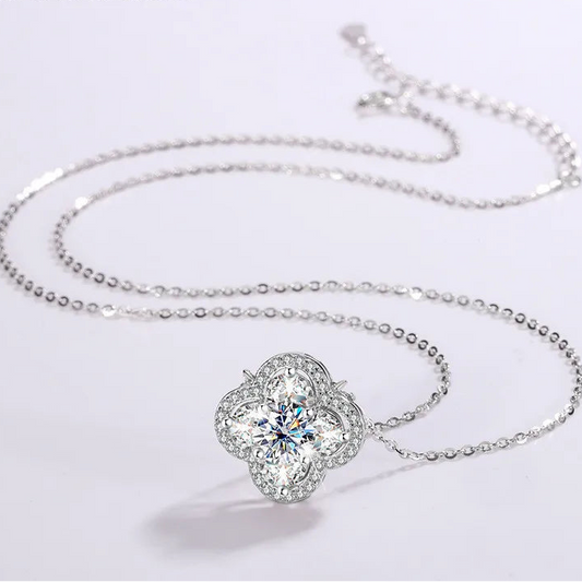 Silver necklace with a floral pendant on a light gray background, featuring the brand 'CODERIA'.