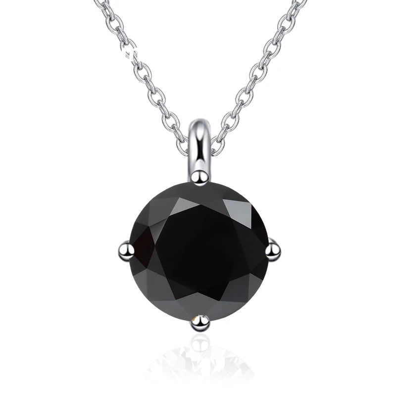 Black gemstone pendant on a silver chain against a white background