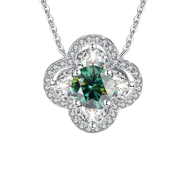 Silver necklace with a green gemstone pendant on a white background, featuring the brand 'Coderia'.