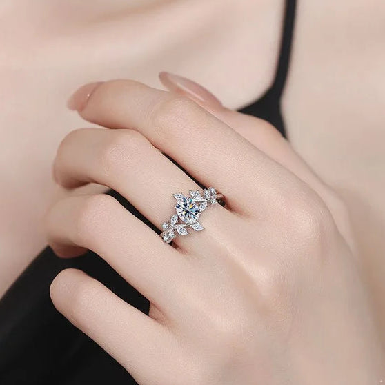 Hand wearing a silver ring with 'CODERIA' branding and 'Real Sterling Silver 925' stamp.