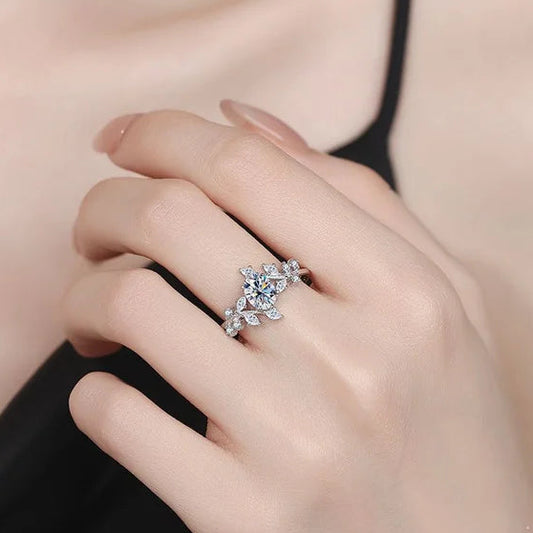 Hand wearing a silver ring with 'CODERIA' branding and 'Real Sterling Silver 925' stamp.