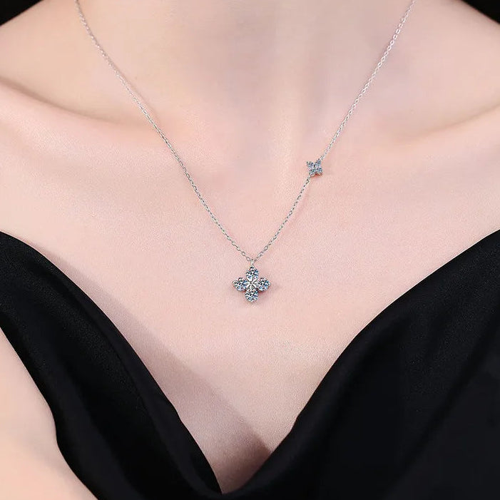 Silver necklace with a star pendant on a model wearing a black top, branded 'CODERIA'.