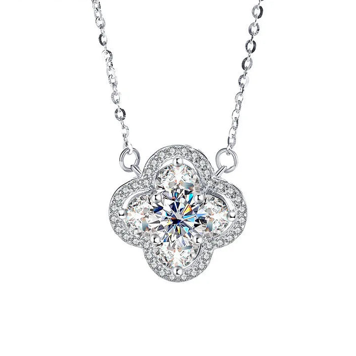 Silver necklace with a flower-shaped pendant featuring a large central gemstone on a white background, branded 'CODERIA'.