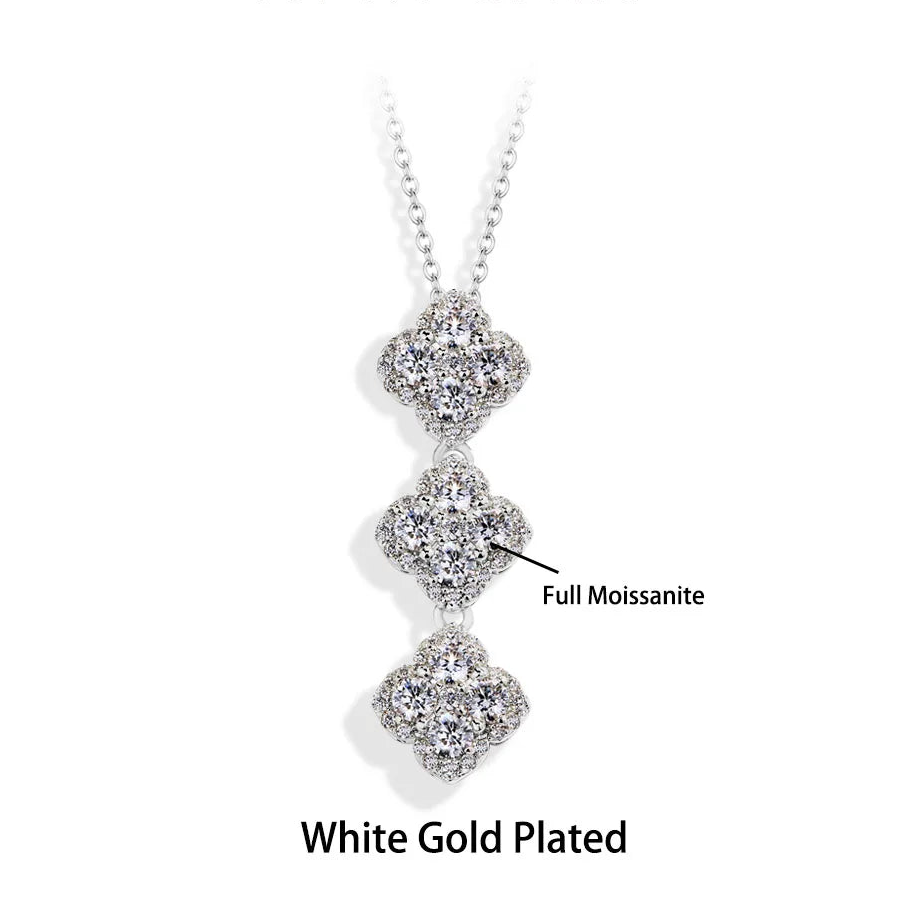 White gold plated necklace with three diamond-like stones on a white background, branded 'Atta Gems'.